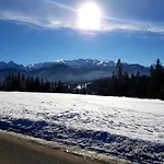 Otuleni Tatrami Kościelisko